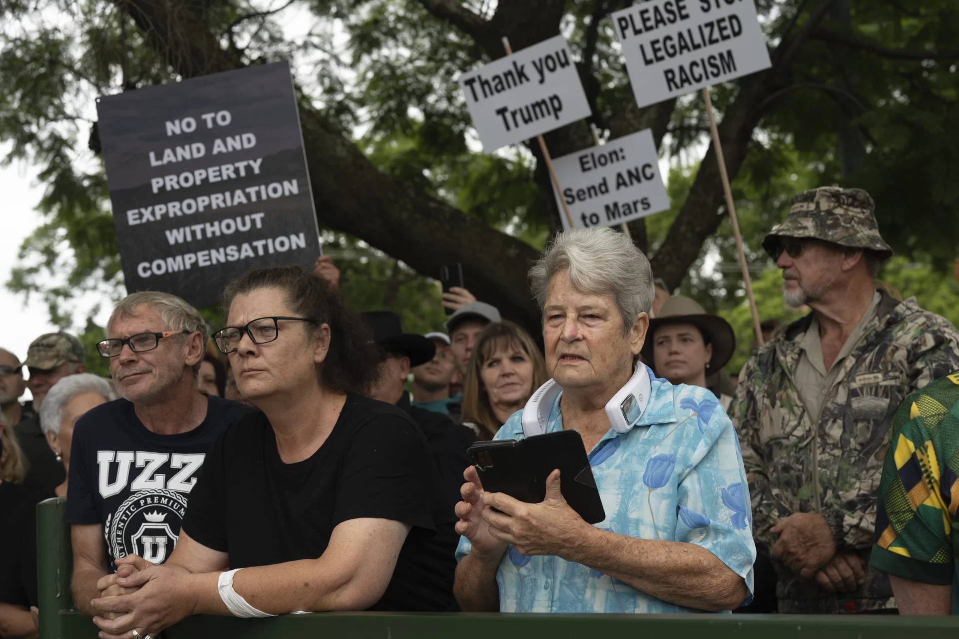 White South Africans show support for U.S. President Donald Trump in front of U.S. Embassy in Pretoria, South Africa, Feb. 15, 2025. (Credit: Jerome Delay/AP.)