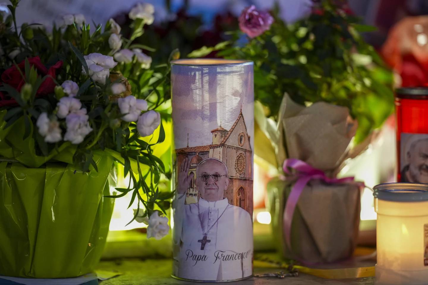 Candles and flowers for Pope Francis are laid in front of the Gemelli Hospital in Rome Wednesday, March 19, 2025. (Credit: Andrew Medichini/AP.)