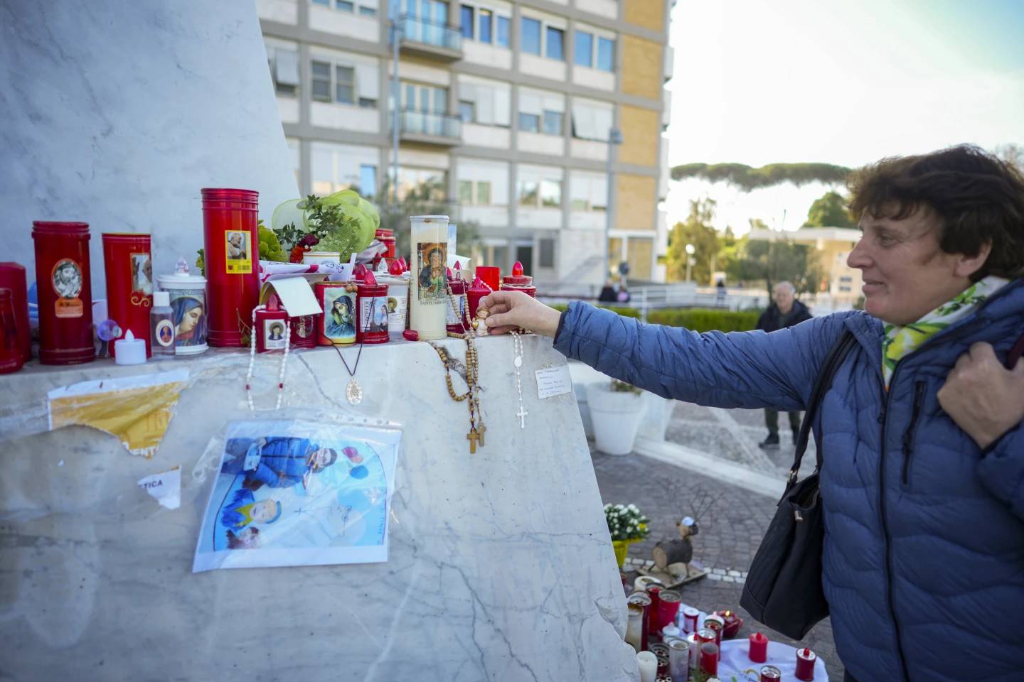 People pray for Pope Francis in front of the Gemelli Hospital in Rome, Tuesday, March 11, 2025. (Credit: Andrew Medichini/AP.)