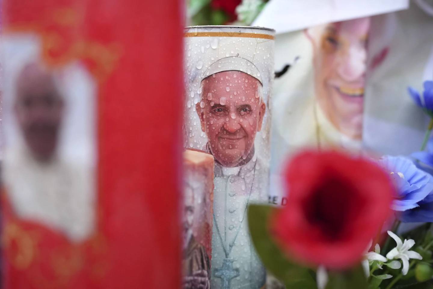 Candles and flowers for Pope Francis are seen at the Gemelli Hospital in Rome Tuesday, Feb. 25, 2025. (Credit: Alessandra Tarantino/AP.)