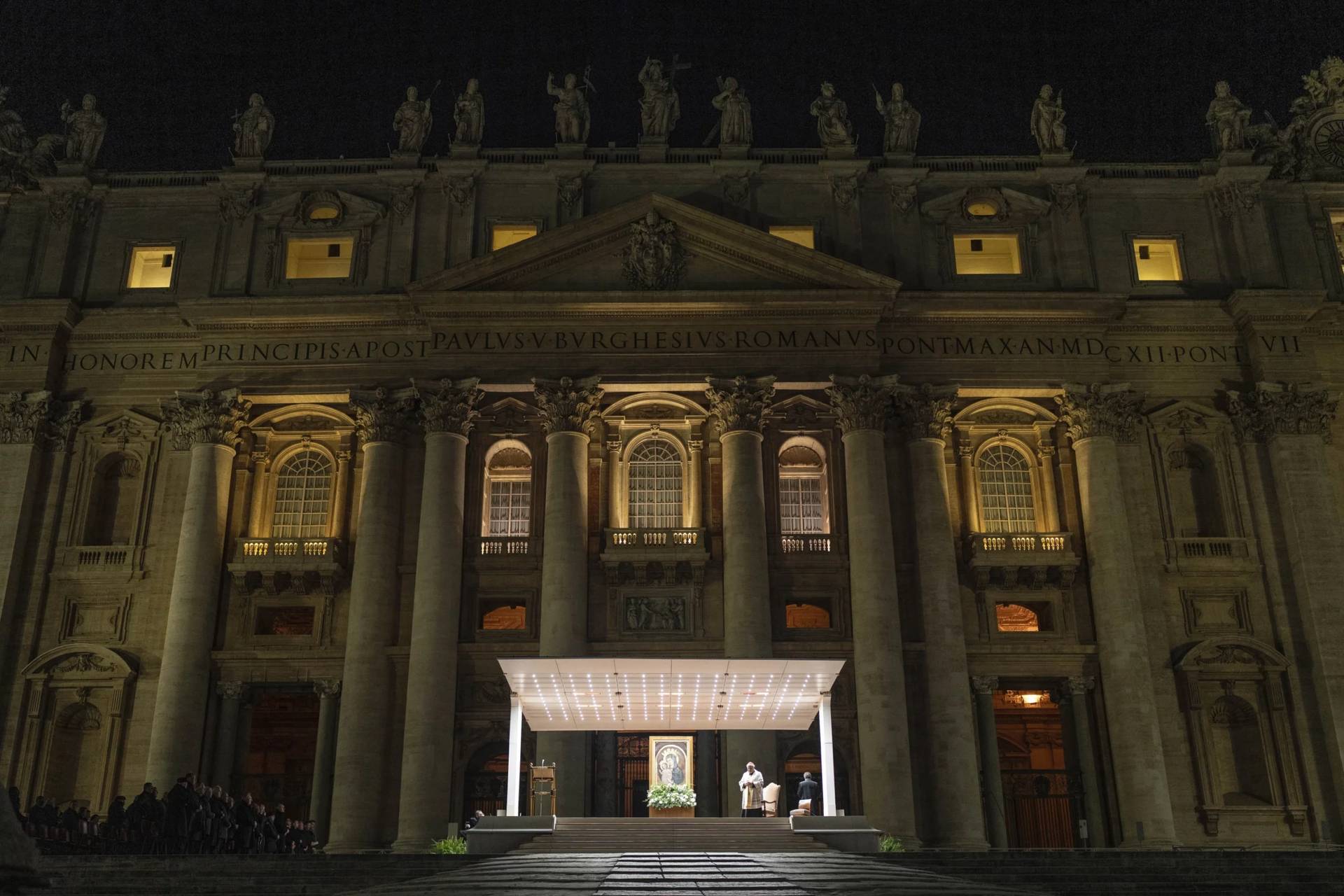 Cardinal Konrad Krajewski, papal almoner, leads a nightly rosary for the health of Pope Francis in St. Peter's Square at the Vatican on Sunday, March 2, 2025. (Credit: Mosa'ab Elshamy/AP.)