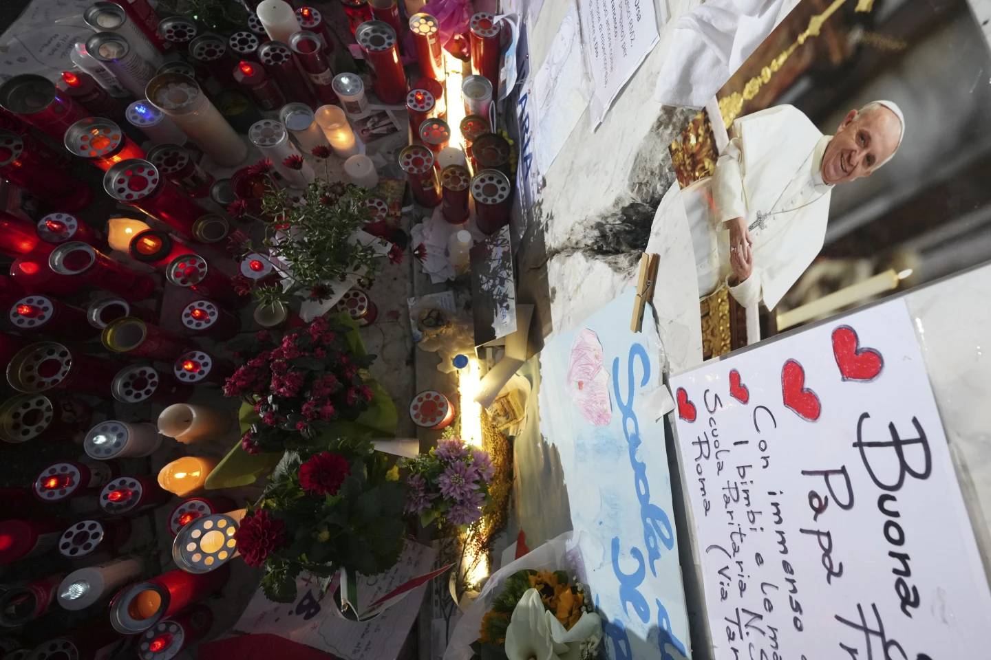 People pray for Pope Francis in front of Gemelli Hospital in Rome on Friday, March 7, 2025. (Credit: Andrew Medichini/AP.)