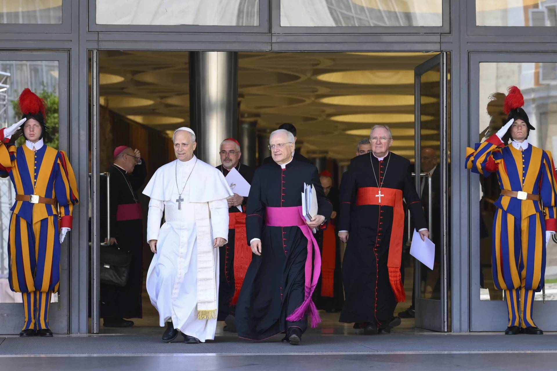 Pope Leo XIV, with Monsignor Leonardo Sapienza, walks out of the Vatican's Synod Hall on May 10, 2025. (Credit: Vatican Media.)