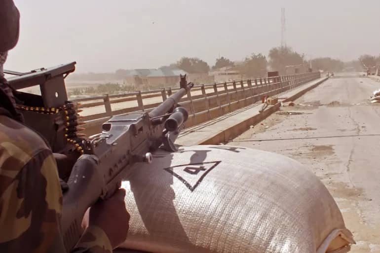 Cameroon soldiers guard at a lookout post as they take part in operations against Boko Haram fighters. (Credit: Edwin Kindzeka Moki/AP.)