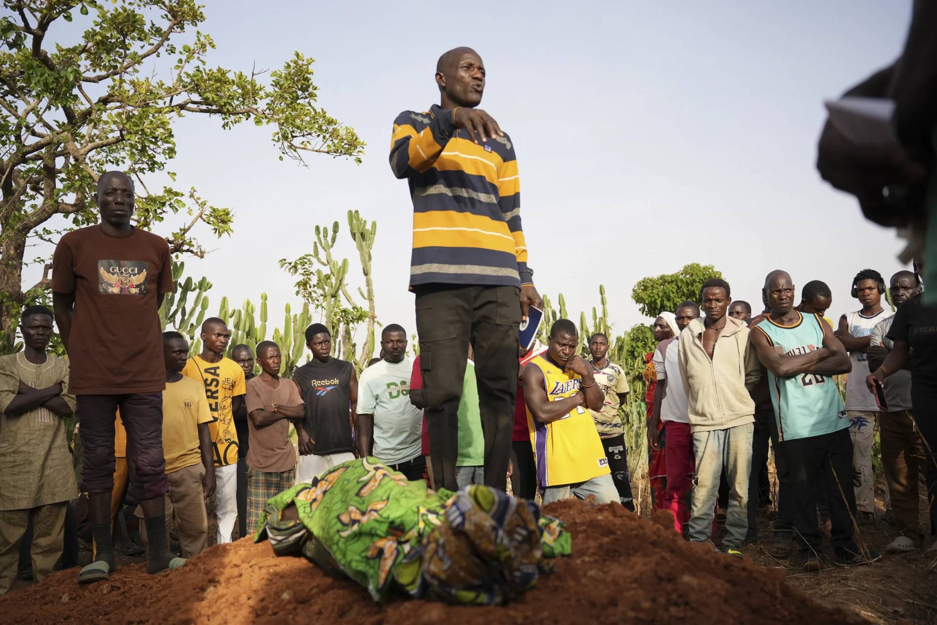People attend the funeral of a man that was killed by attackers in the Zike farming community in north-central Nigeria on April 15, 2025. (Credit: Samson Omale/AP.)