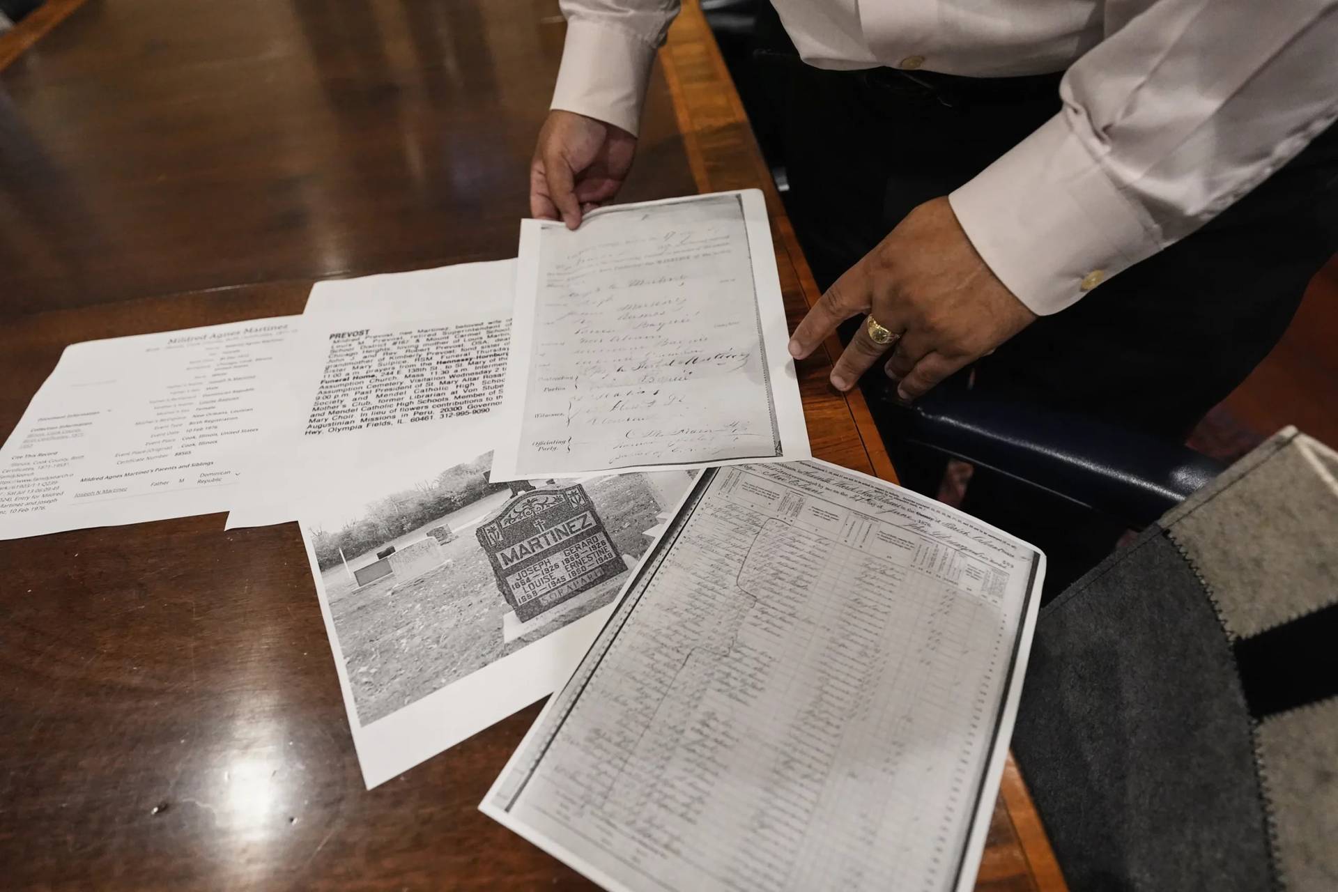 Jari Honora, family historian for the Historic New Orleans Collection, shows the genealogy material of the grandparents of Pope Leo XIV in New Orleans, Louisiana, on May 9, 2025. (Credit: Gerald Herbert/AP.)