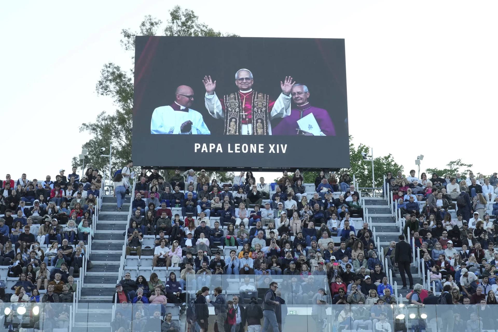 A screen flags the news of new Pope Leo XIV during the second round match between Fabio Fognini of Italy and Jacob Fearnley at the Italian Open tennis tournament in Rome on May 8, 2025. (Credit: Alfredo Falcone/LaPresse via AP.)