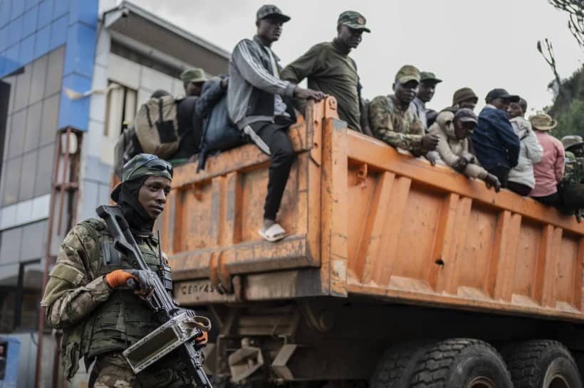 Former members of the Armed Forces of the Democratic Republic of Congo (FARDC) and police officers who allegedly surrendered to M23 rebels arrive in Goma, Congo, Sunday, Feb. 23, 2025. (Credit: Moses Sawasawa/AP.)