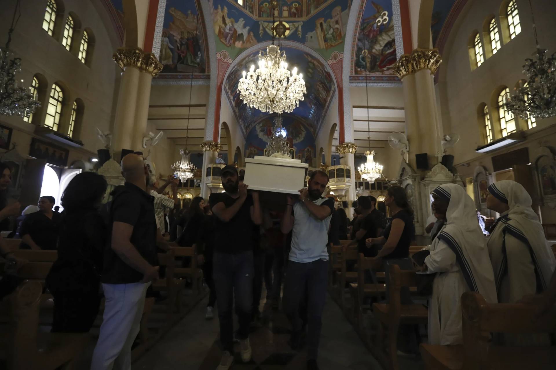 Pallbearers carry the coffin of a victim of Sunday’s suicide bombing at Mar Elias Greek Orthodox Church during a funeral service at al-Saleeb Church in the al-Qasaa neighborhood of Damascus, Syria, Tuesday, June 24, 2025. (Credit: Omar Sanadiki/AP.)