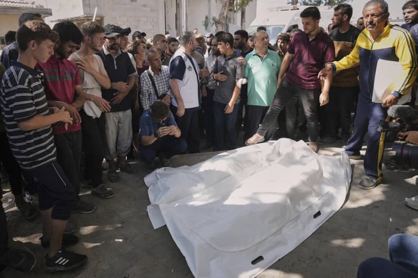 Palestinians gather around the bodies of Dr. Marwan al-Sultan, the director of the Indonesian Hospital in the northern Gaza Strip, his wife, his daughter, and his son-in-law, after they were killed in an Israeli airstrike, at Shifa Hospital in Gaza City, on July 2, 2025. (Credit: Jehad Alshrafi/AP.)