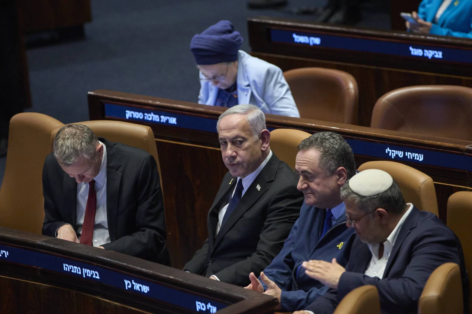 Israel’s Prime Minister Benjamin Netanyahu, surrounded by ministers from the government attends a session of the Knesset, Israel’s parliament, in Jerusalem, Monday, July 14, 2025. (Credit: Ohad Zwigenberg/AP.)