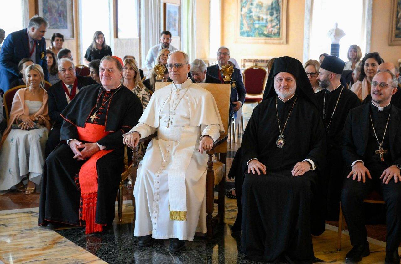 Pope Leo XIV poses with pilgrims on an ecumenical Orthodox-Catholic pilgrimage led by Cardinal Joseph Tobin (l) and Metropolitan Elpidophoros (r) in Castel Gandolfo in Italy on July 17, 2025. (Credit: Vatican Media.)