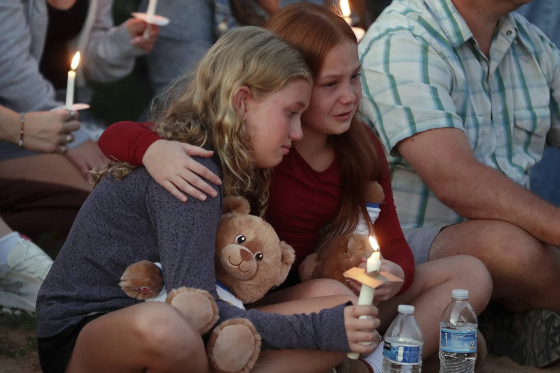 People gather at a vigil at Lynnhurst Park after a shooting at the Annunciation Catholic School on Aug. 27, 2025. (Credit: Bruce Kluckhohn/AP.)