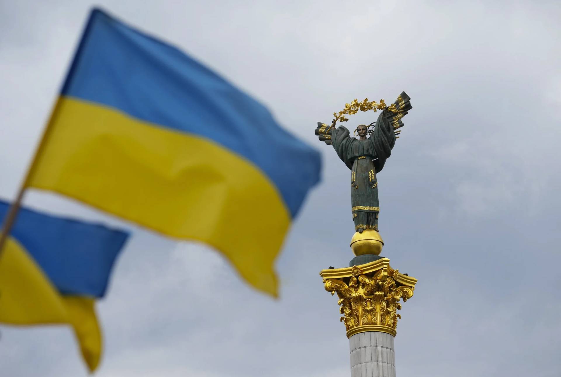 The Independence Monument is pictured as Ukrainian flags blow in the wind in Kyiv, Ukraine, on Aug. 23, 2025. (Credit: Sean Kilpatrick/The Canadian Press via AP.)