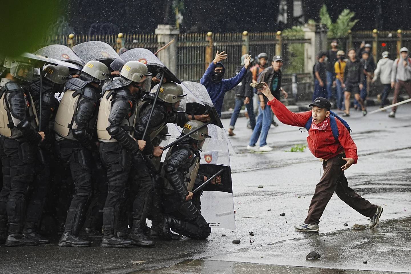 A demonstrator throws a rock against police in Jakarta, Indonesia, Aug. 28, 2025. (AP Achmad Ibrahim/AP.)