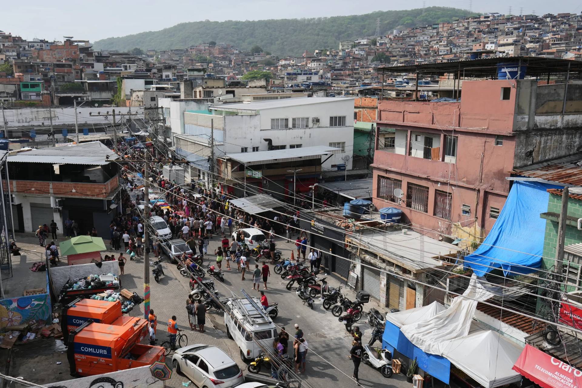 Residents surround the bodies of people killed the day before during a police raid targeting the Comando Vermelho gang in the Complexo da Penha favela of Rio de Janeiro, Brazil, Wednesday, Oct. 29, 2025. (Credit: Silvia Izquierdo/AP.)
