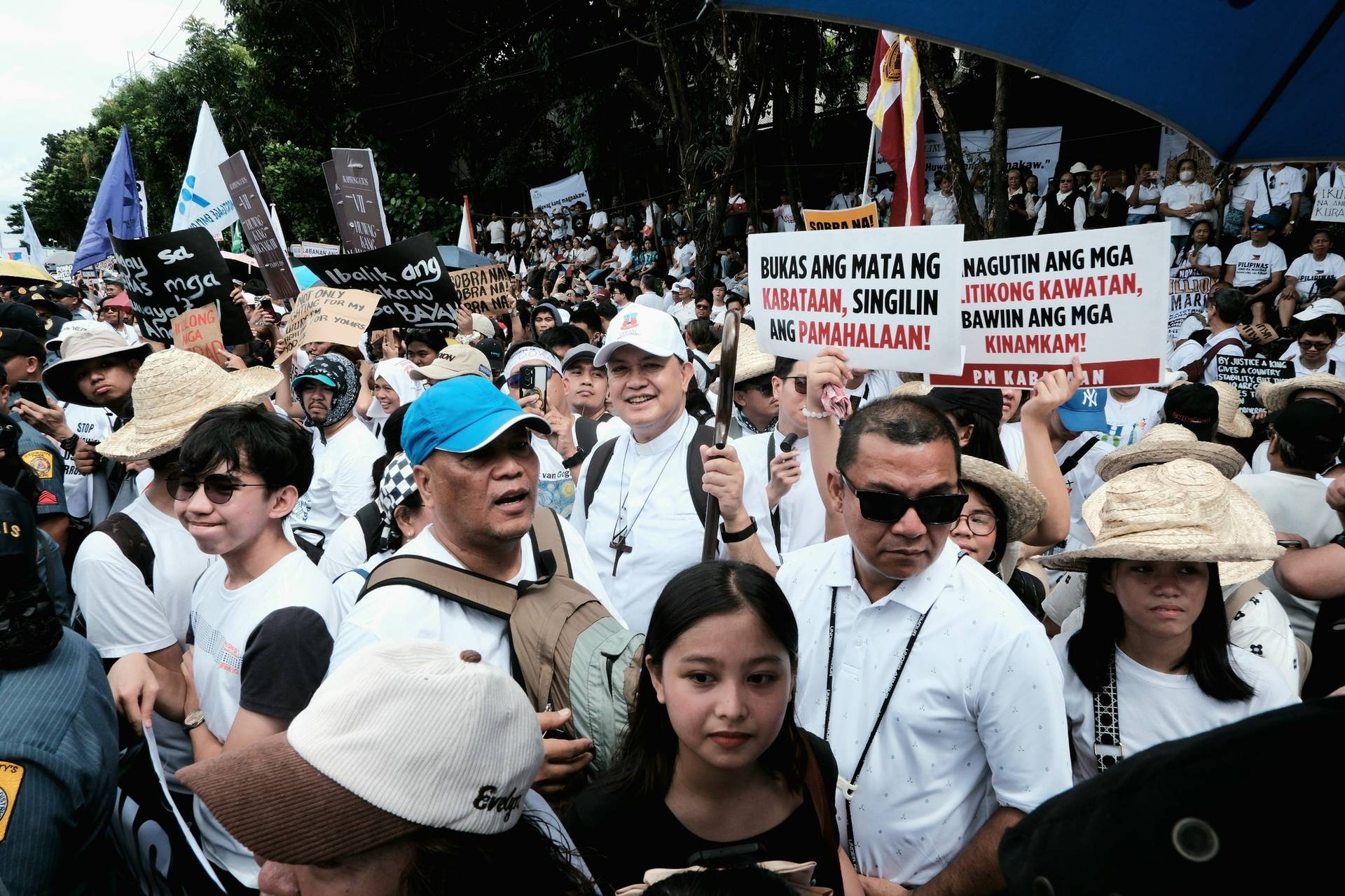 Cardinal Pablo Virgilio David, holding his wooden crozier, joins anti-corruption protesters wearing white at the Trillion Peso March in Quezon City, Philippines, Sept. 21, 2025. (Credit: Roy Lagarde/CBCP News.)