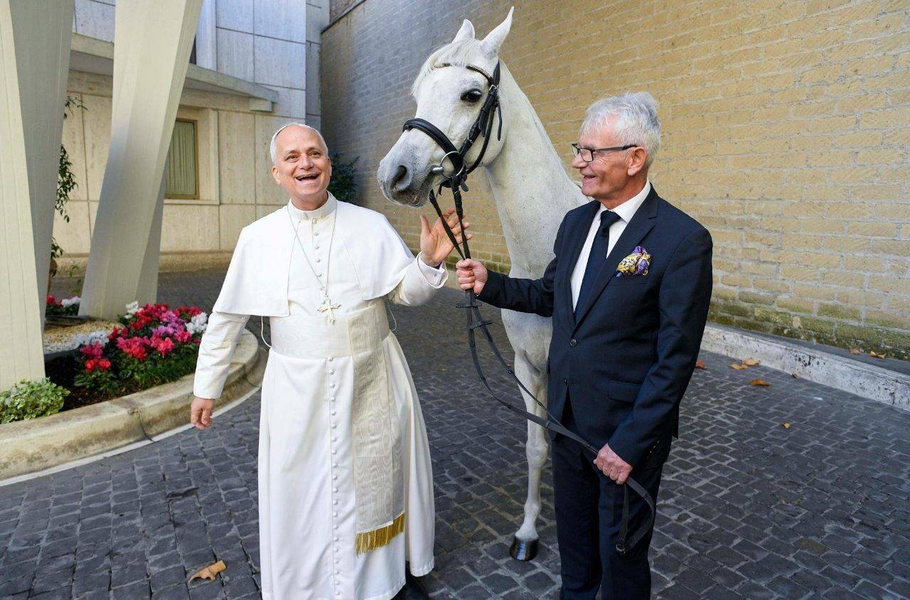 Pope Leo XIV with Andrzej Michalski and Proton at the Vatican on Oct. 15, 2025. (Credit: Vatican Media.)