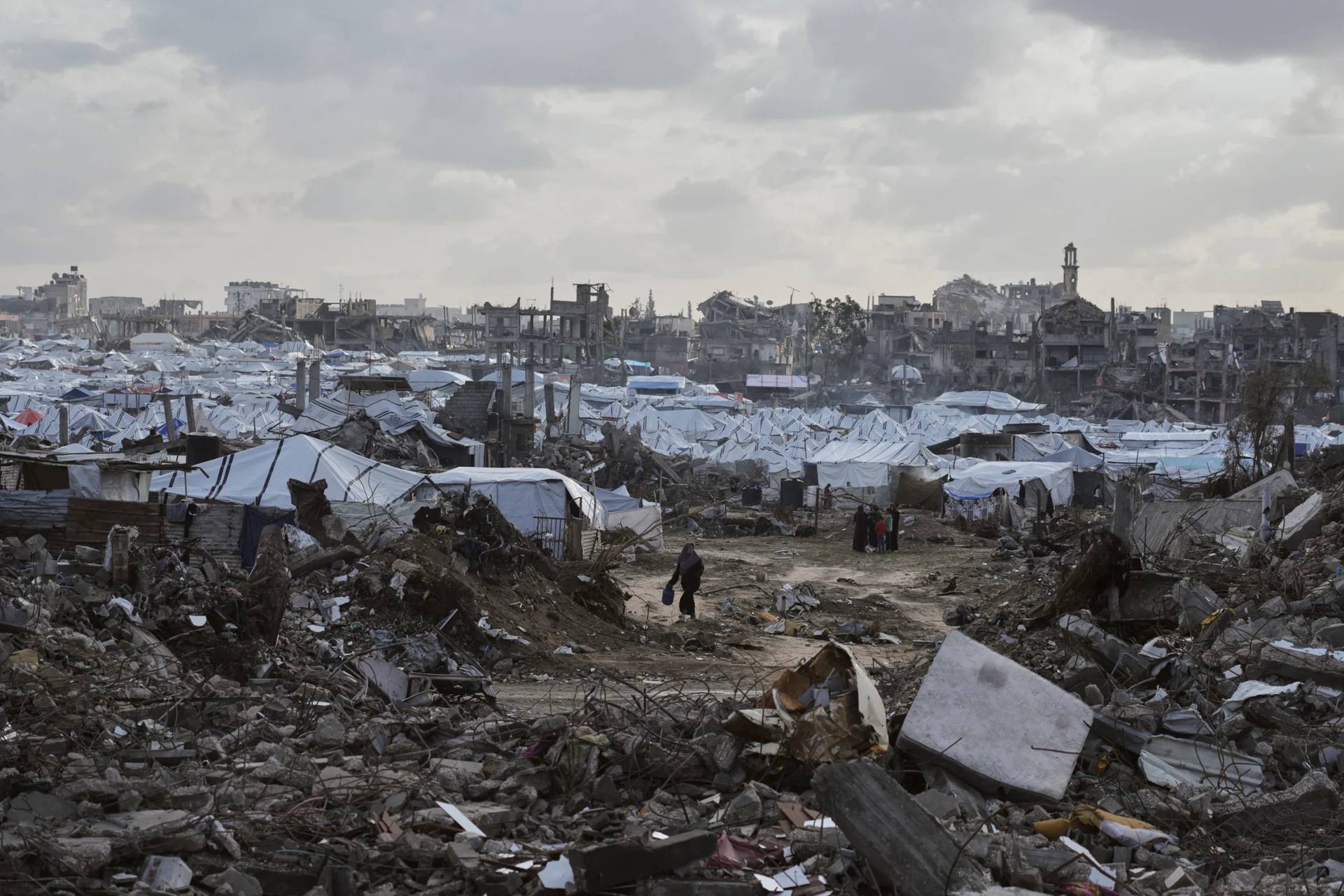 A tent camp for displaced Palestinians stand amid the destruction left by Israeli strikes north of Gaza City Tuesday, Nov. 25, 2025. (Credit: Jehad Alshrafi/AP.)
