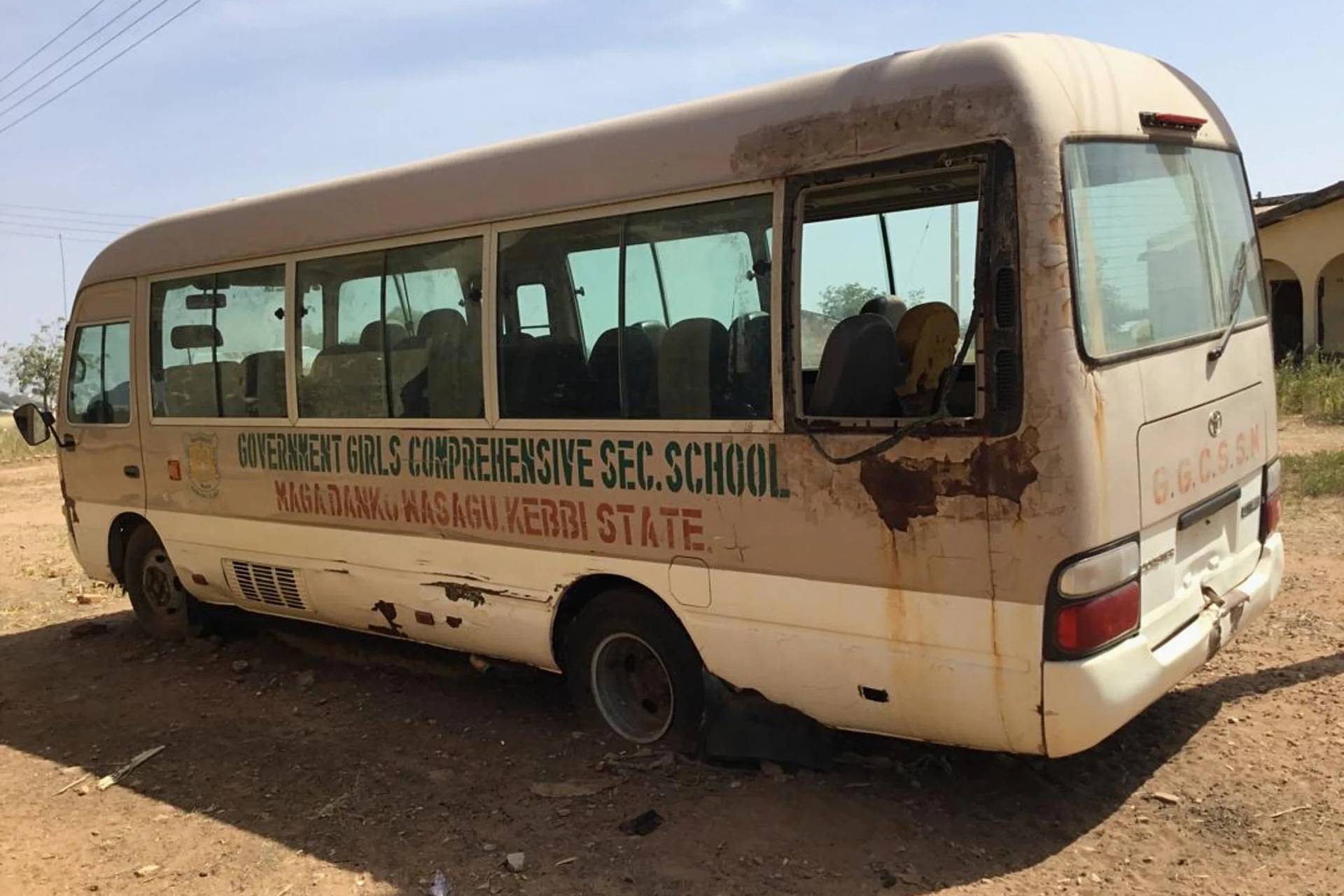 A view of the school bus of the Government Girls Comprehensive Secondary School, where gunmen on Monday attacked the school dormitory and abducted schoolgirls, is seen in Kebbi, Nigeria, Tuesday, Nov. 18, 2025. (Credit: Tunde Omolehin/AP.)