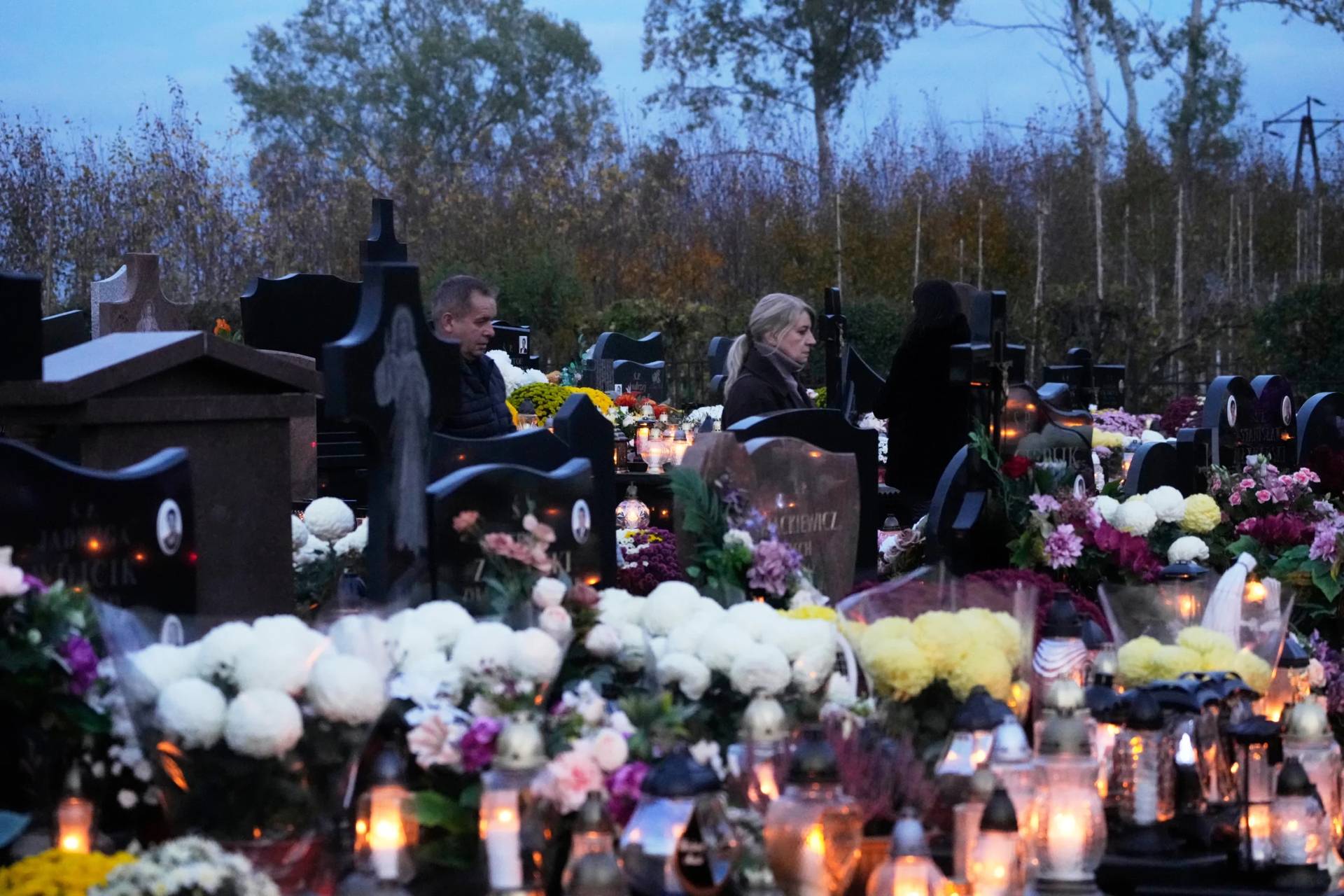 People observe All Saints Day in Koczewo, Poland, on Nov. 1, 2025. (Credit: Czarek Sokolowski/AP.)
