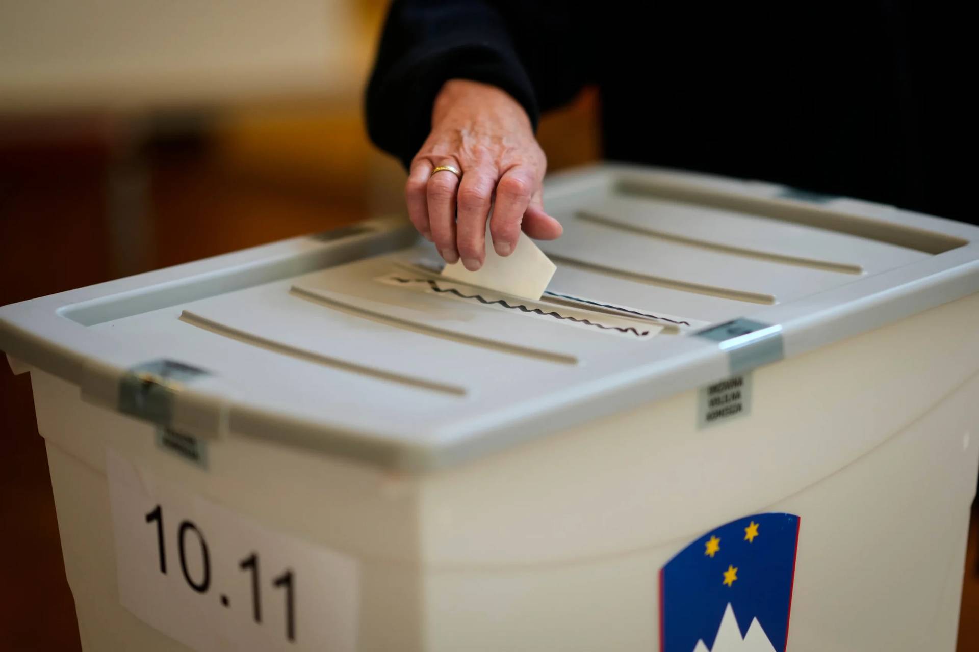 A voter casts her ballot at a polling station during the referendum on assisted dying for terminally ill patients, in Domzale, Slovenia, Sunday, Nov. 23, 2025. (Credit: Darko Bandic/AP.)