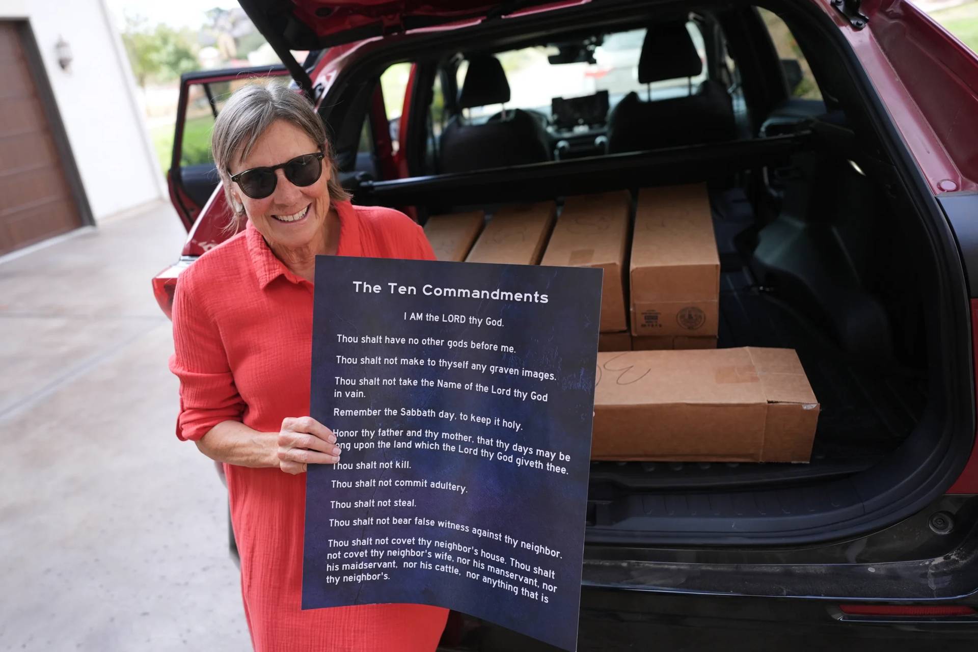 Debbie Leimback displays one of the hundreds of Ten Commandments posters she was preparing to deliver to local public schools in New Braunfels, Texas, Monday, Nov. 17, 2025. (Credit: Eric Gay/AP.)