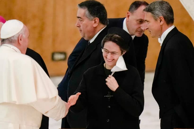 Pope Francis shakes hands with Sister Raffaella Petrini, secretary general of the Vatican’s governorship, at the Vatican, on Dec. 23, 2021. (Credit: Alessandra Tarantino/AP.)