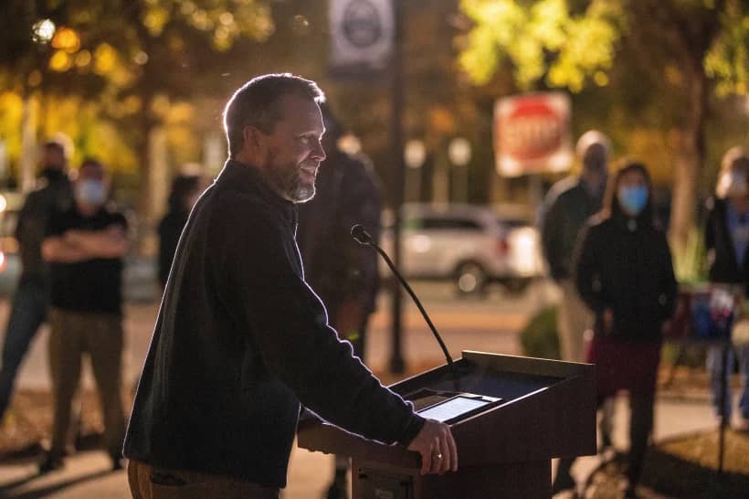 Bishop Steve Wood of St. Andrew’s Church thanks health care workers at East Cooper Medical Center, where he was a patient fighting COVID-19 easier in the year, during an evening event to honor health care workers at East Cooper Medical Center Monday, Dec. 14, 2020. (Credit: Grace Beahm Alford/The Post And Courier via AP.)