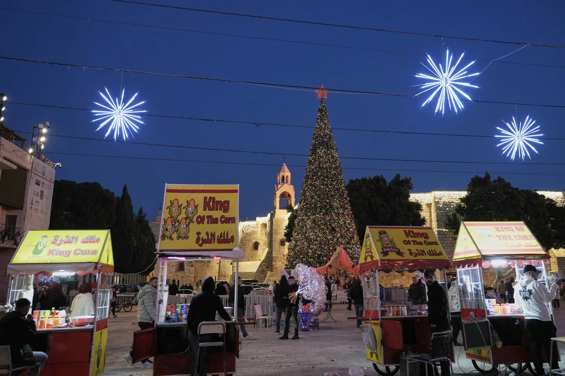 Palestinian vendors wait for clients in Manger Square in the West Bank city of Bethlehem, Tuesday, Dec. 16, 2025. (Credit: Mahmoud Illean/AP.)