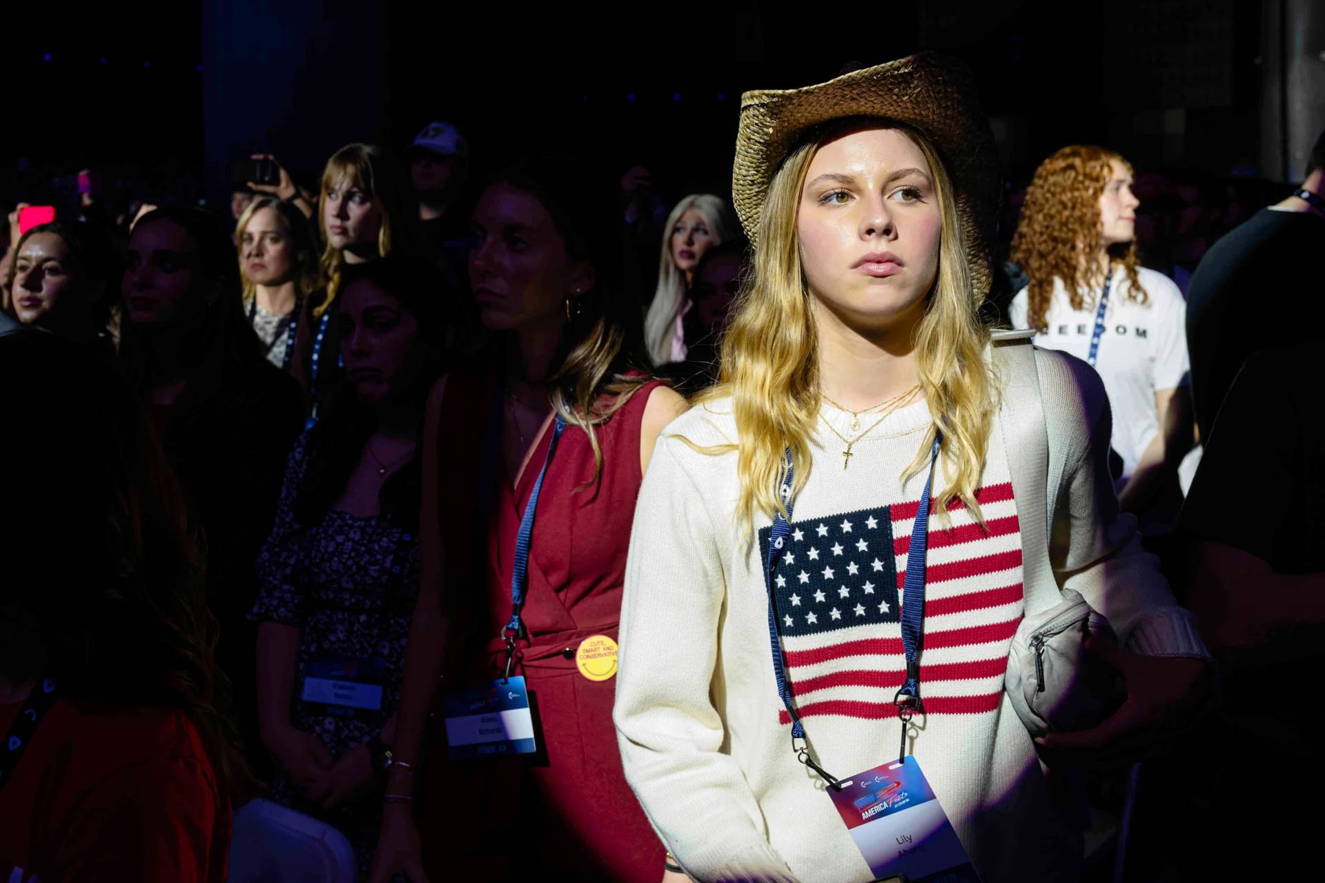 Attendees stand during Turning Point USA's AmericaFest 2025, on Dec. 18, 2025 in Phoenix, Arizona. (Credit: Jon Cherry/AP.)