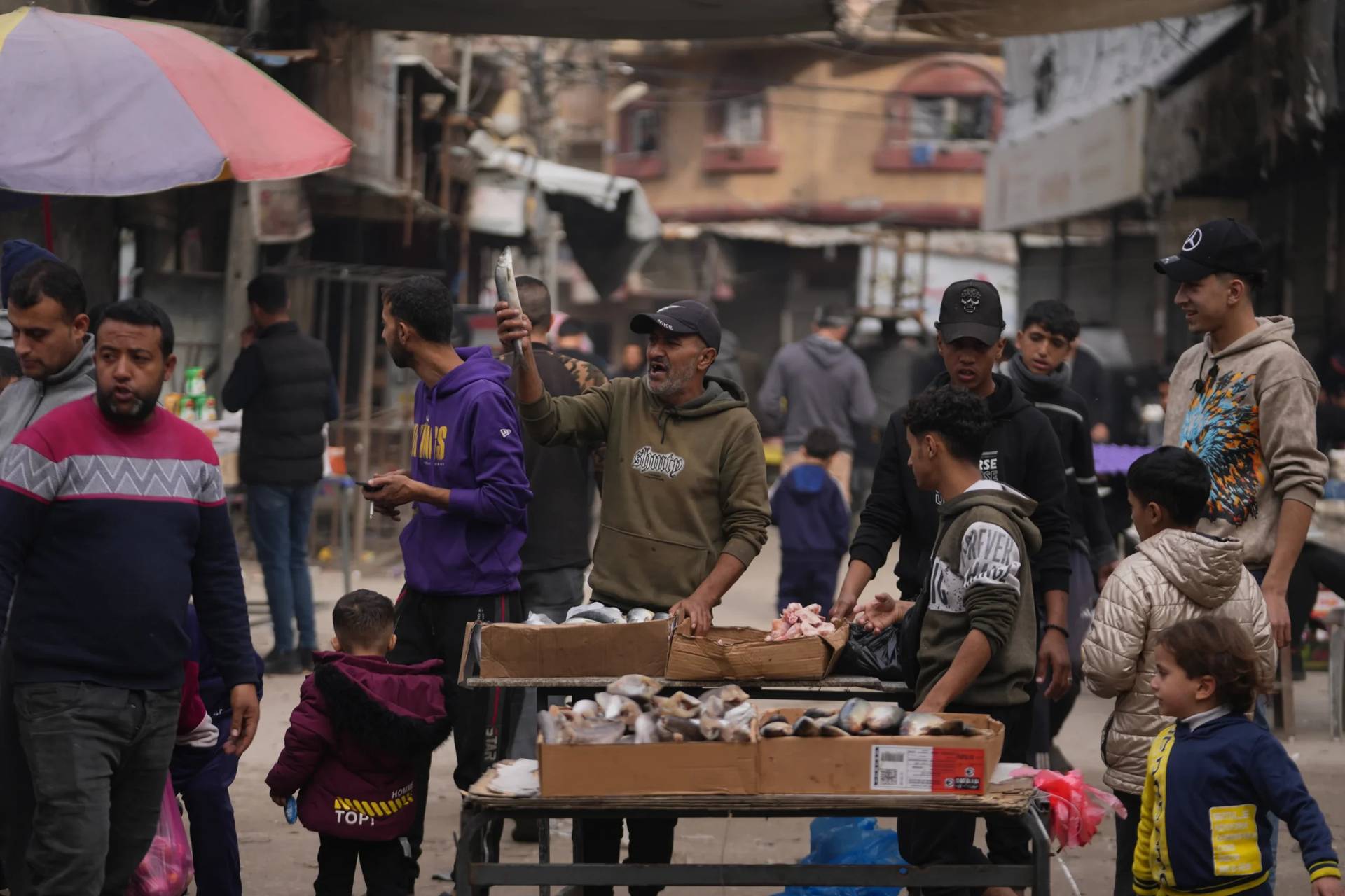 A Palestinian vendor displays sardines for sale on a street of a local market in Gaza City, Friday, Dec. 19, 2025. (Credit: Abdel Kareem Hana/AP.)