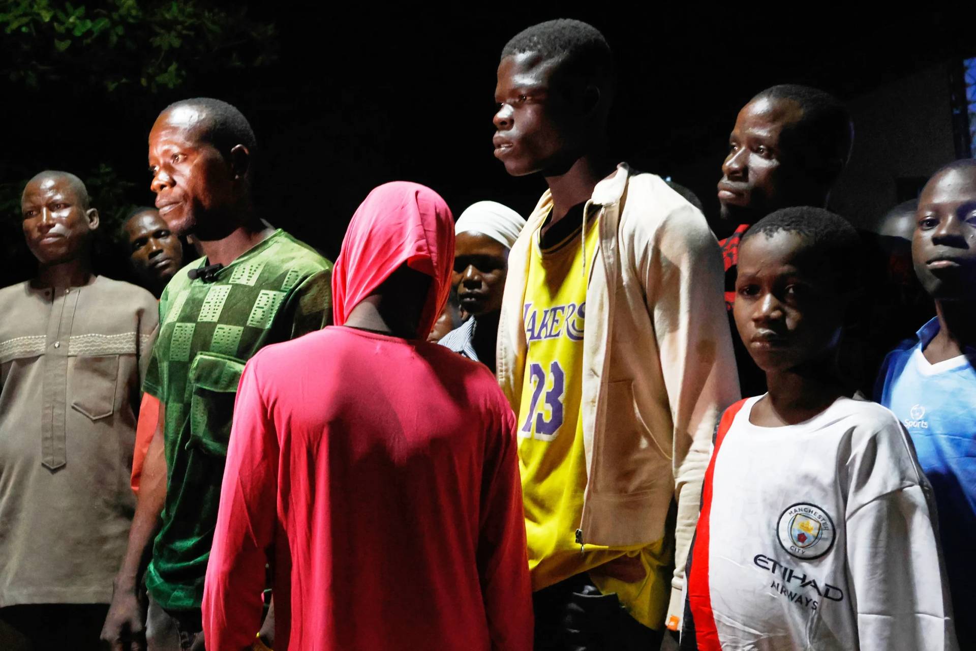 Freed students of St. Mary’s Catholic School in the Papiri community are reunited with their parents on Dec. 9, 2025. (Credit: Afolabi Sotunde/AP.)