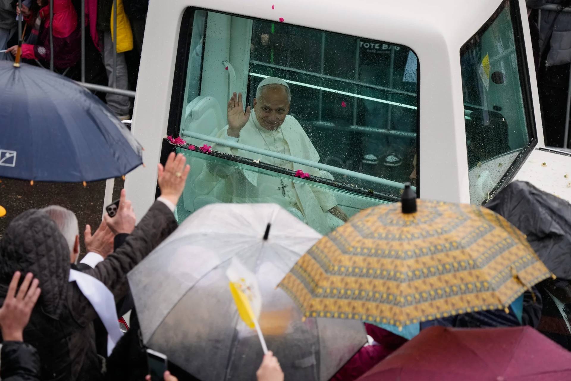 Pope Leo XIV waves from his popemobile in Annaya, Lebanon, on Dec. 1, 2025. (Credit: Hassan Ammar/AP.)