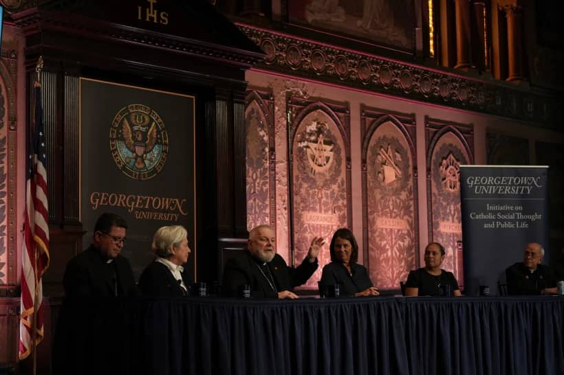 The archbishop of Miami, Thomas Wenski, raises his hand while addressing a crowd during a panel on immigration at Georgetown University in Washington, Thursday, Sept. 11, 2025. (Credit: Luis Andres Henao/AP.)