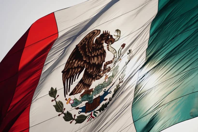 Mexico’s coat of arms decorates a large flag in the city’s Zocalo square, Mexico City, Thursday, Nov. 13, 2025. (Credit: Claudia Rosel/AP.)