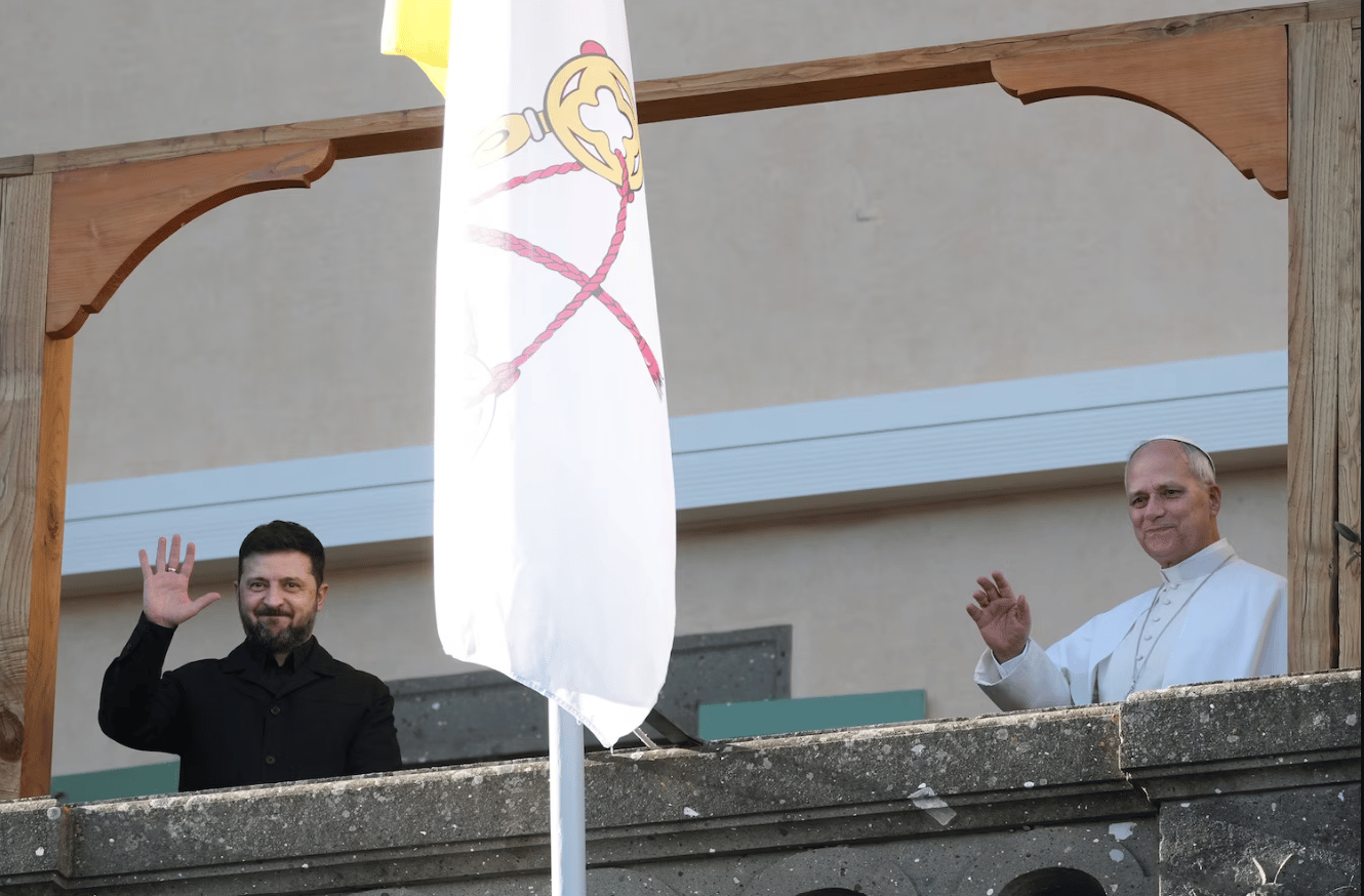 Ukraine's President Volodymyr Zelenskyy and Pope Leo XIV wave to journalists during their meeting in Castel Gandolfo, Italy, on Dec. 9, 2025. (Credit: Andrew Medichini/AP.)