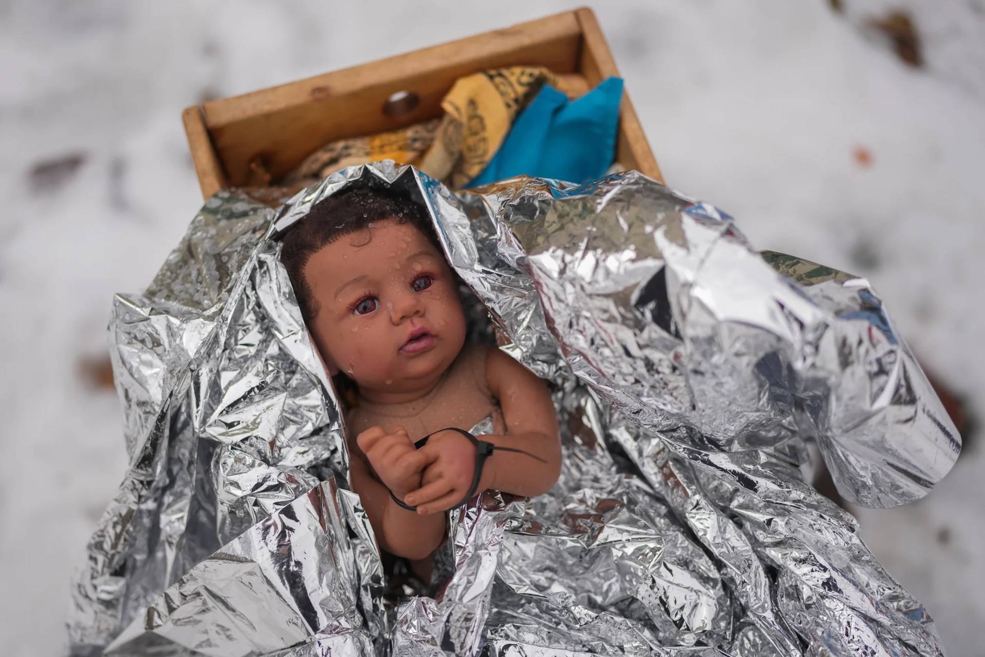 A doll representing the baby Jesus is zip-tied in the Nativity scene outside of Lake Street Church of Evanston, Wednesday, Dec. 10, 2025, in Evanston, Ill. (Credit: Erin Hooley/AP.)