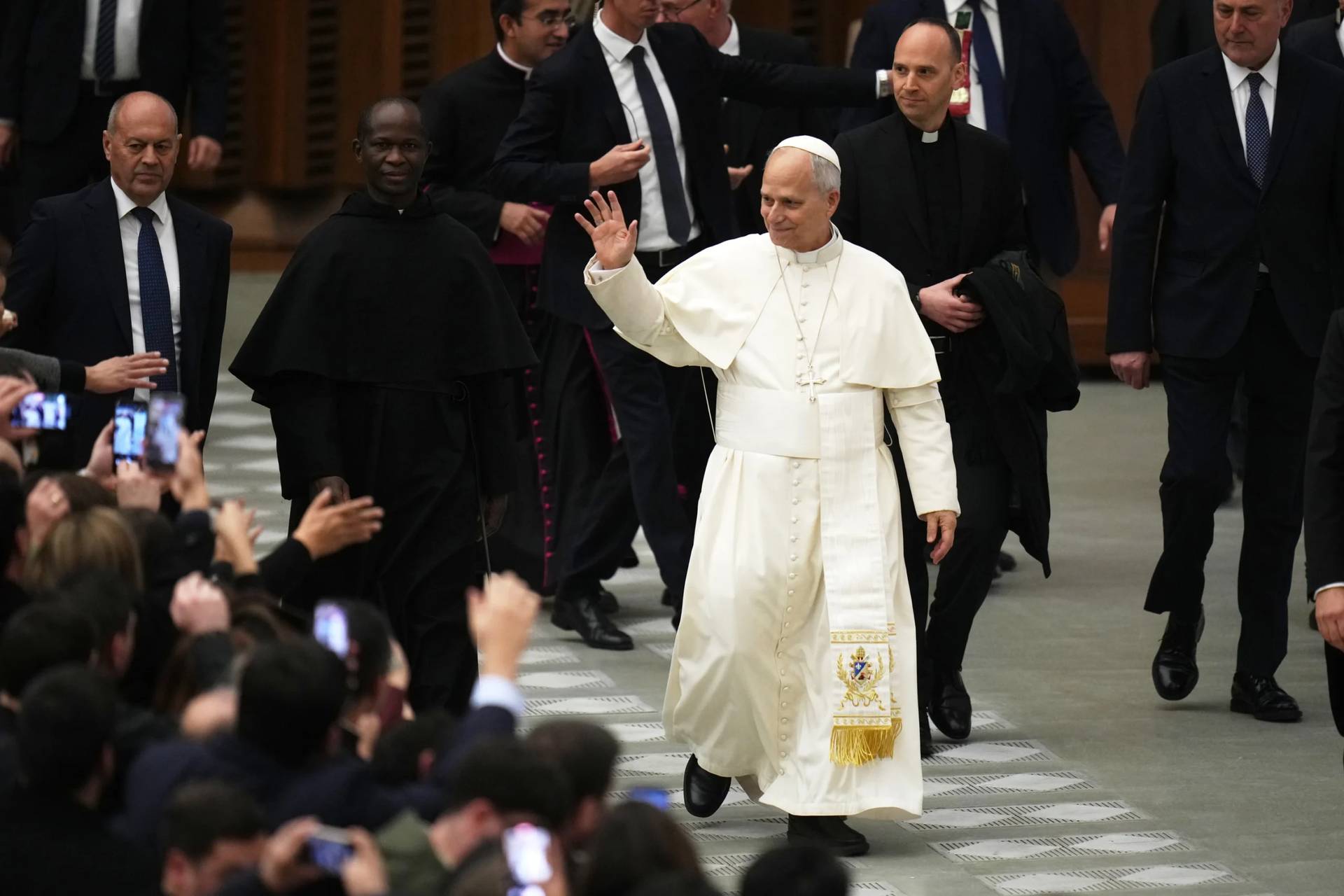 Pope Leo XIV waves people at the end of his weekly general audience in the Paul VI Hall at the Vatican, Wednesday, Jan. 7, 2026. (Credit: Alessandra Tarantino/AP.)