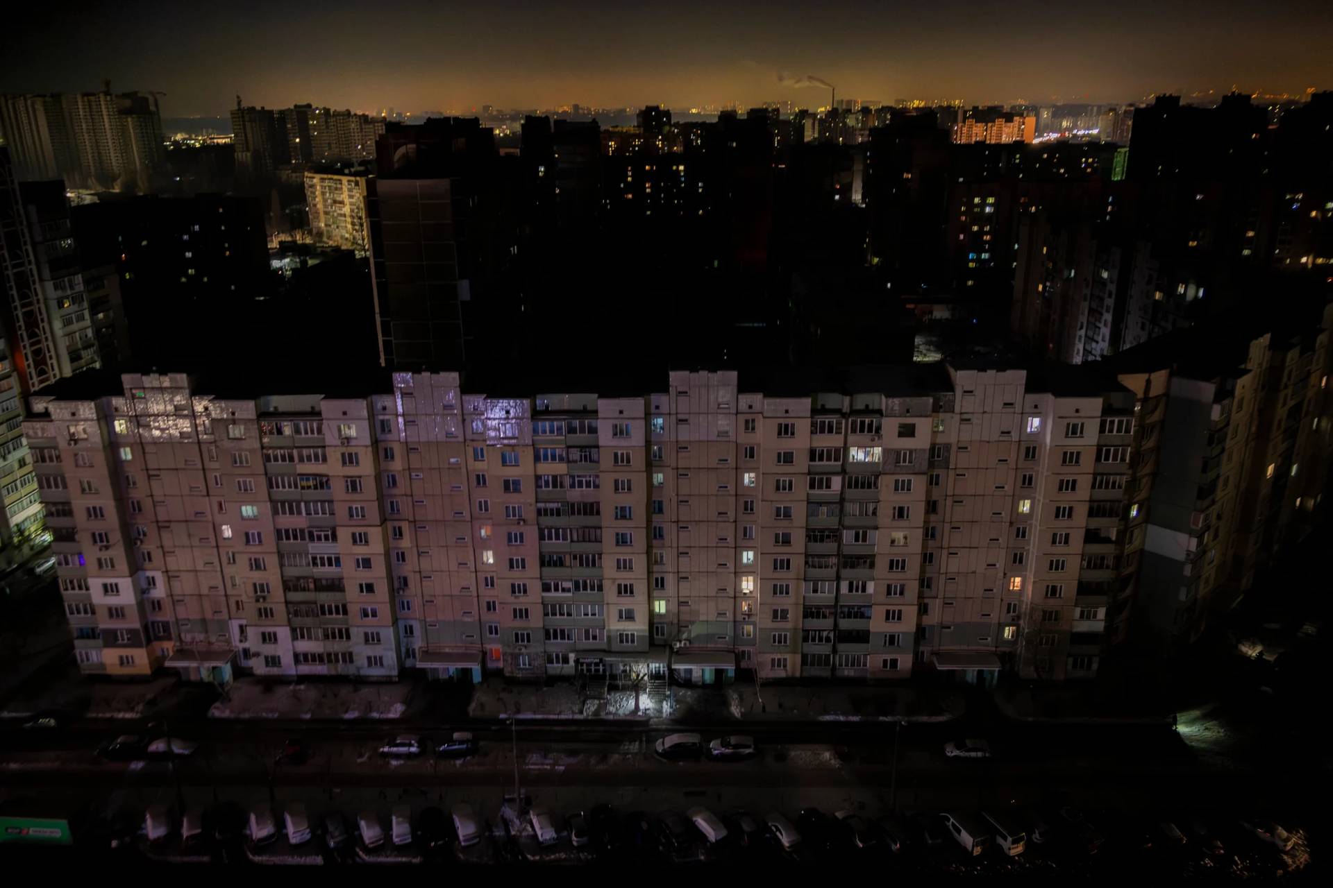 Residential multistory buildings are seen in the dark during large-scale power outages following Russian strikes on Ukraine’s power grid in Kyiv, Ukraine, Tuesday, Jan. 20, 2026. (Credit: Dan Bashakov/AP.)