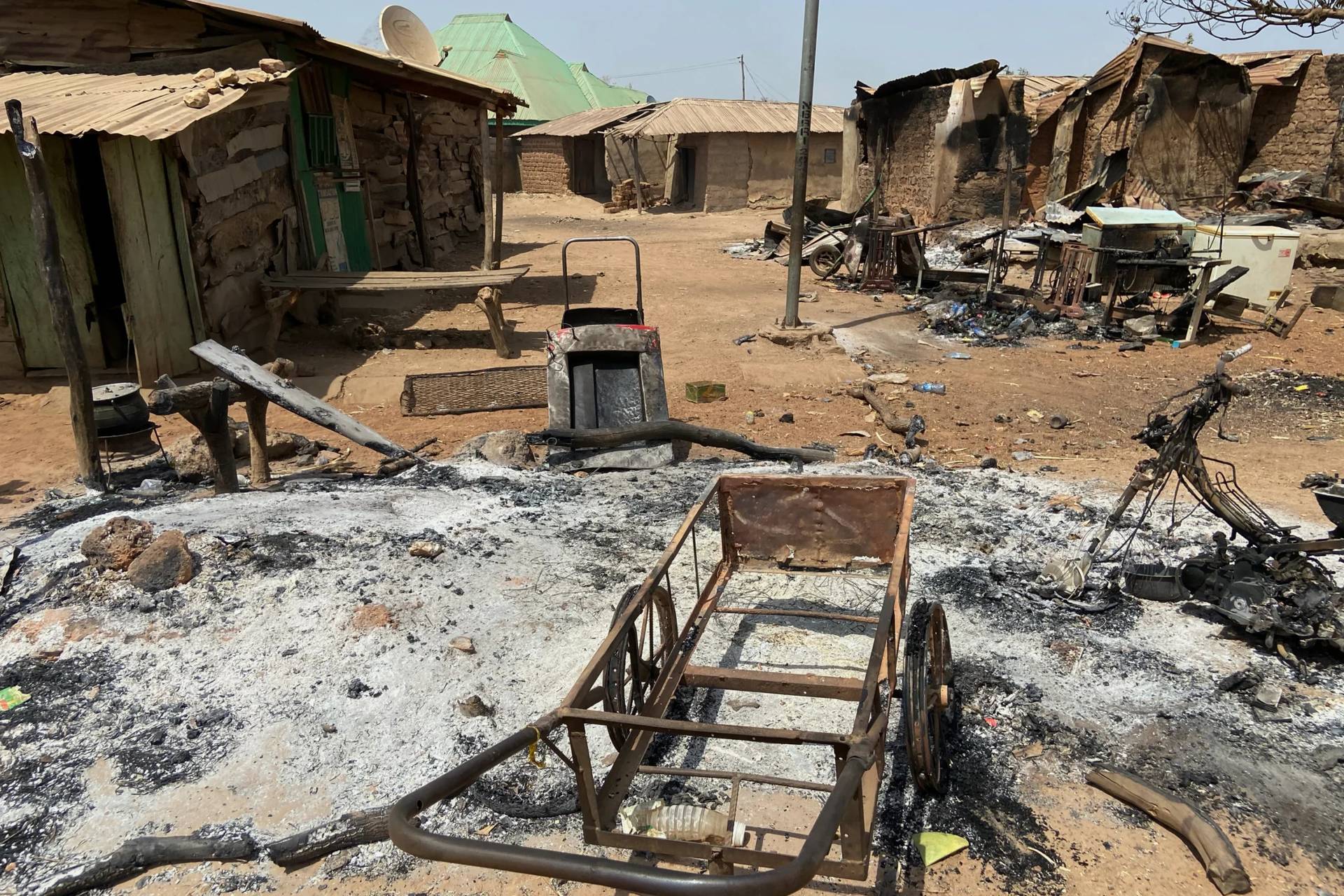 Burned homes and tools stand on an ash covered ground, days after an attack in the village of Woro, Nigeria, Thursday, Feb. 5, 2026. (Credit: Musa Salim/AP.)