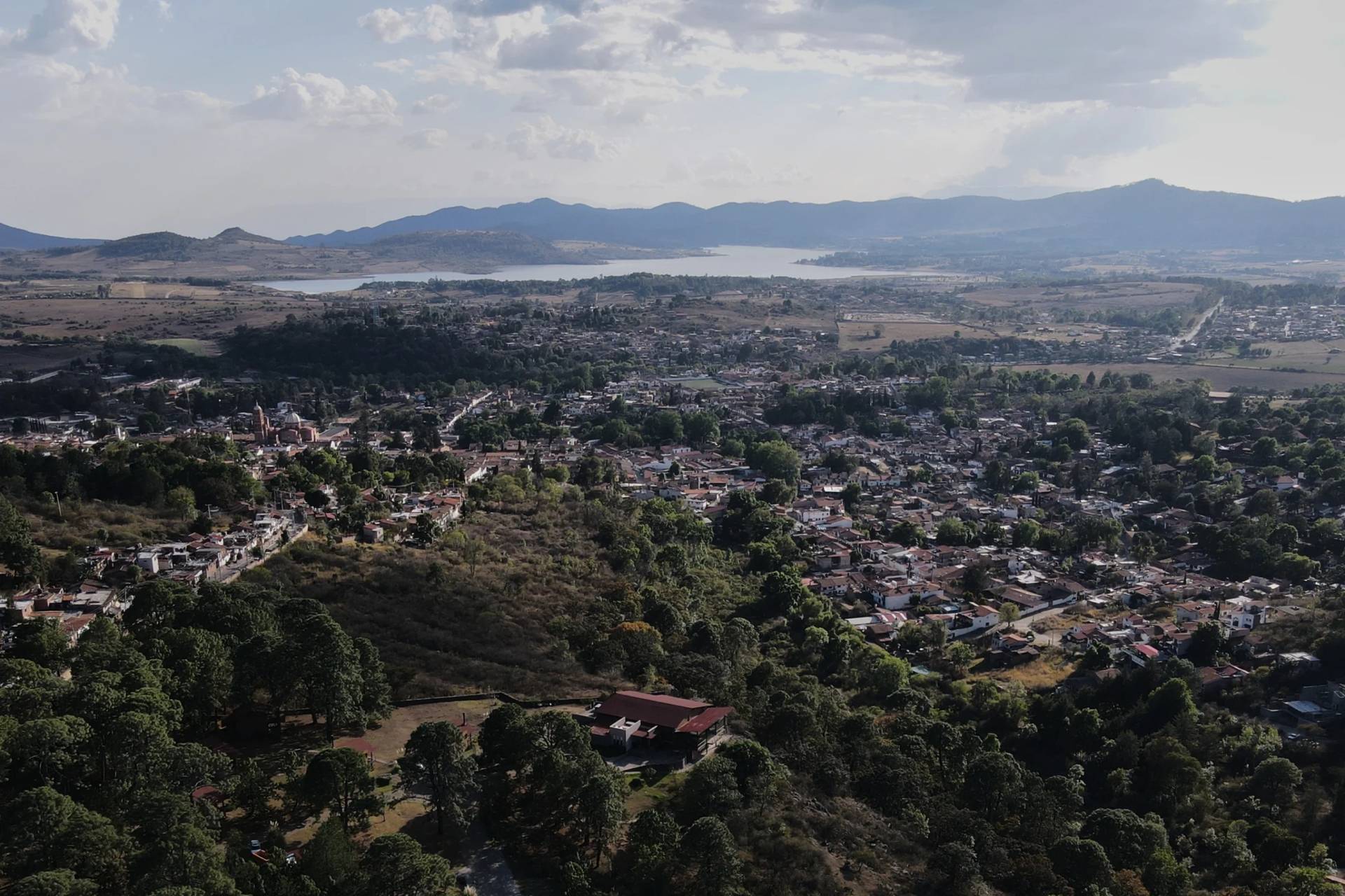 Trees and buildings dot Tapalpa, Mexico, Monday, Feb. 23, 2026, a day after the Mexican army killed Jalisco New Generation Cartel leader Nemesio Oseguera Cervantes, known as "El Mencho." (Credit: Marco Ugarte/AP.)