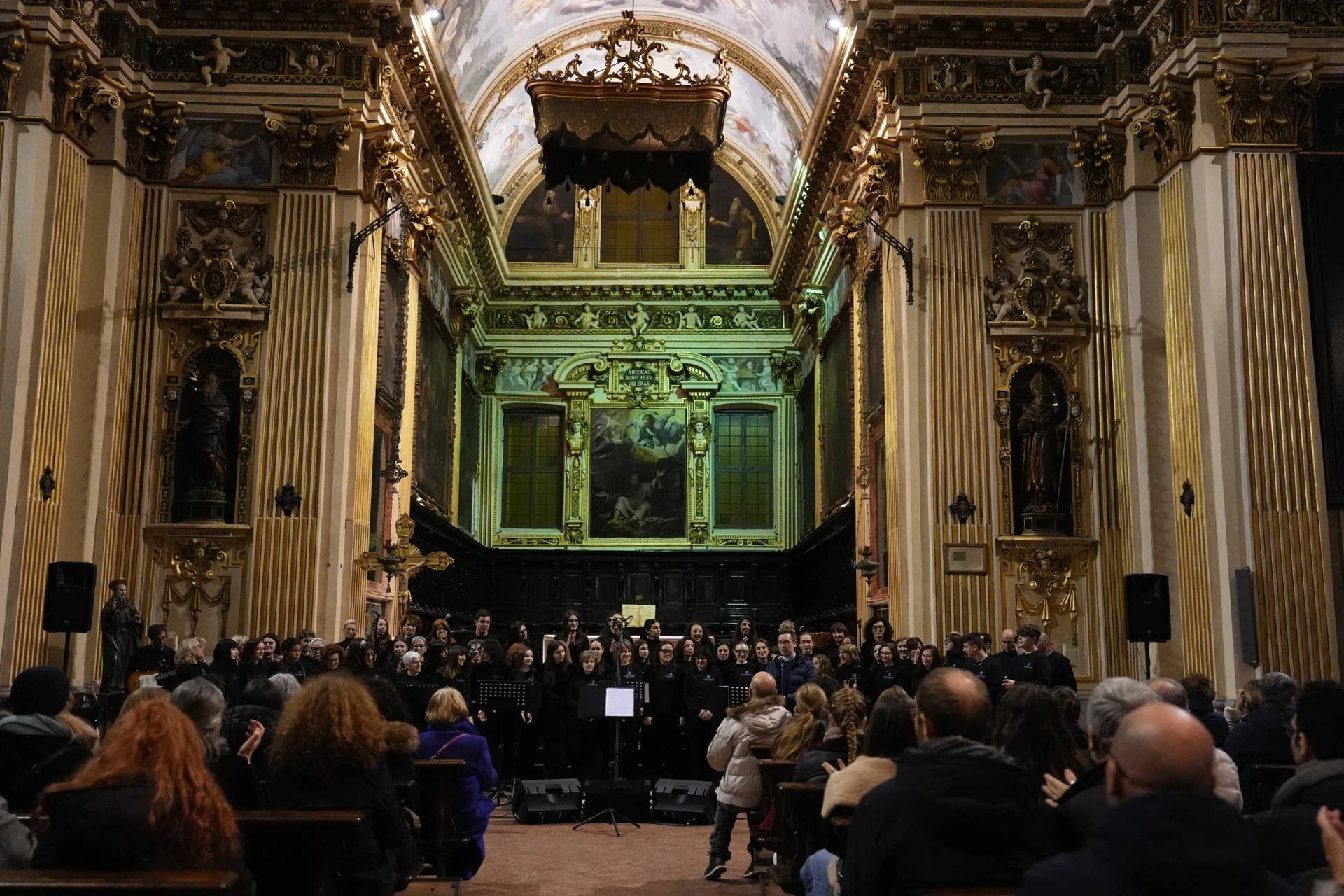 Members of Coro Terzo Tempo gather inside the church of Sant’Antonio Abate before a concert in Milan, Italy, on Feb. 18, 2026. (Credit: María Teresa Hernández/AP.)