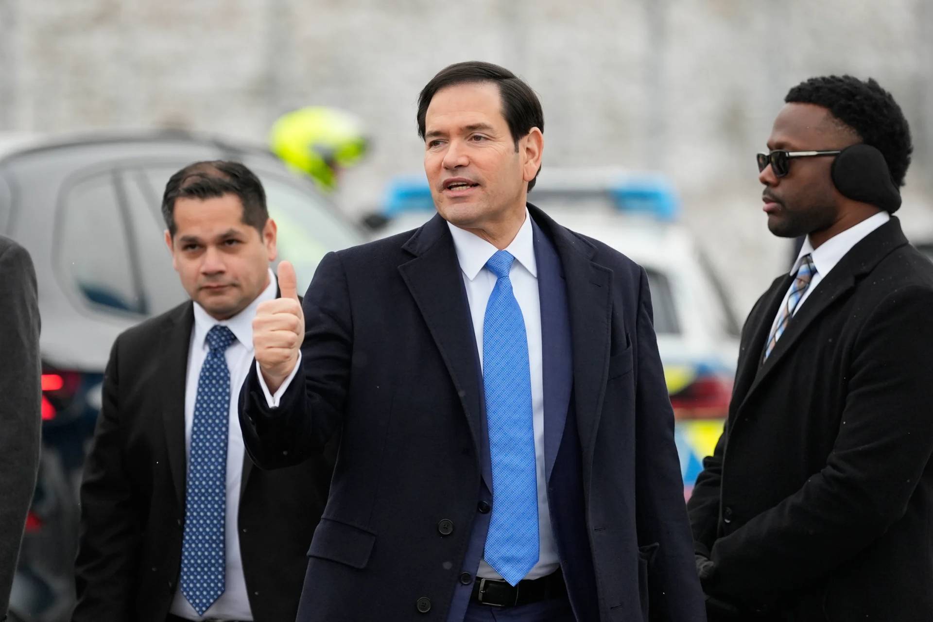 U.S. Secretary of State Marco Rubio gives a thumbs up as he departs Munich International Airport in Munich, Germany, Sunday, Feb. 15, 2026, after attending the Munich Security Conference. (Credit: Alex Brandon/Pool photo via AP.)