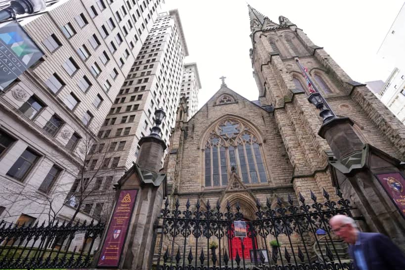 A man walks past Trinity Episcopal Cathedral in downtown Pittsburgh, Wednesday, March 11, 2026. (Credit: Gene J. Puskar/AP.)