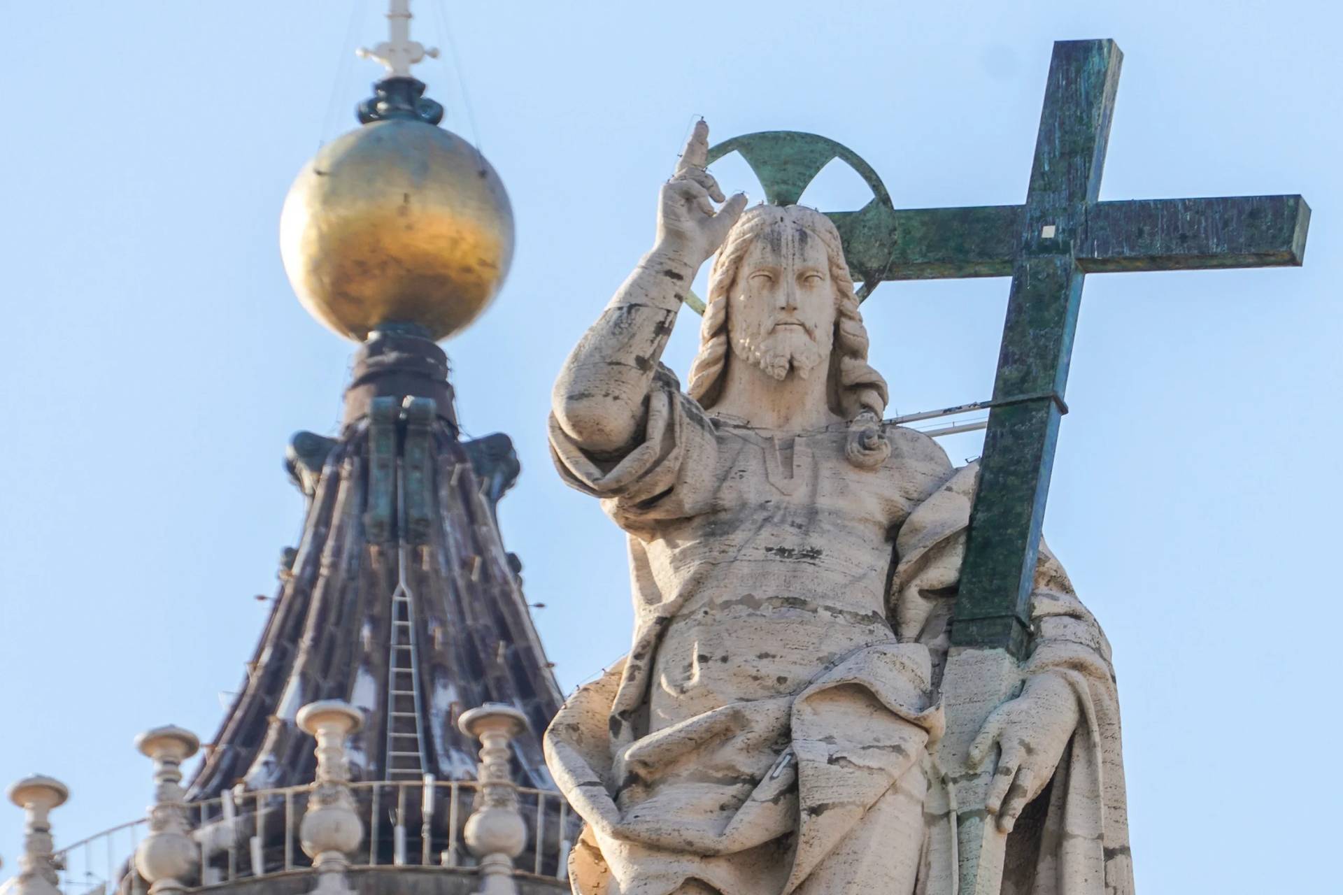 A statue of Jesus Christ on the facade of St. Peter's Basilica at the Vatican, Nov. 10, 2020. (Credit: Andrew Medichini/AP.)