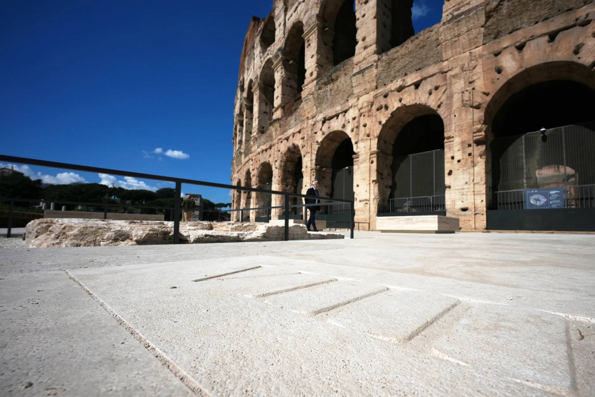 People walk in the new outdoor space created with travertine marble around the Colosseum during it’s inauguration in Rome, Tuesday, March 17, 2026. (Credit: Andrew Medichini/AP.)