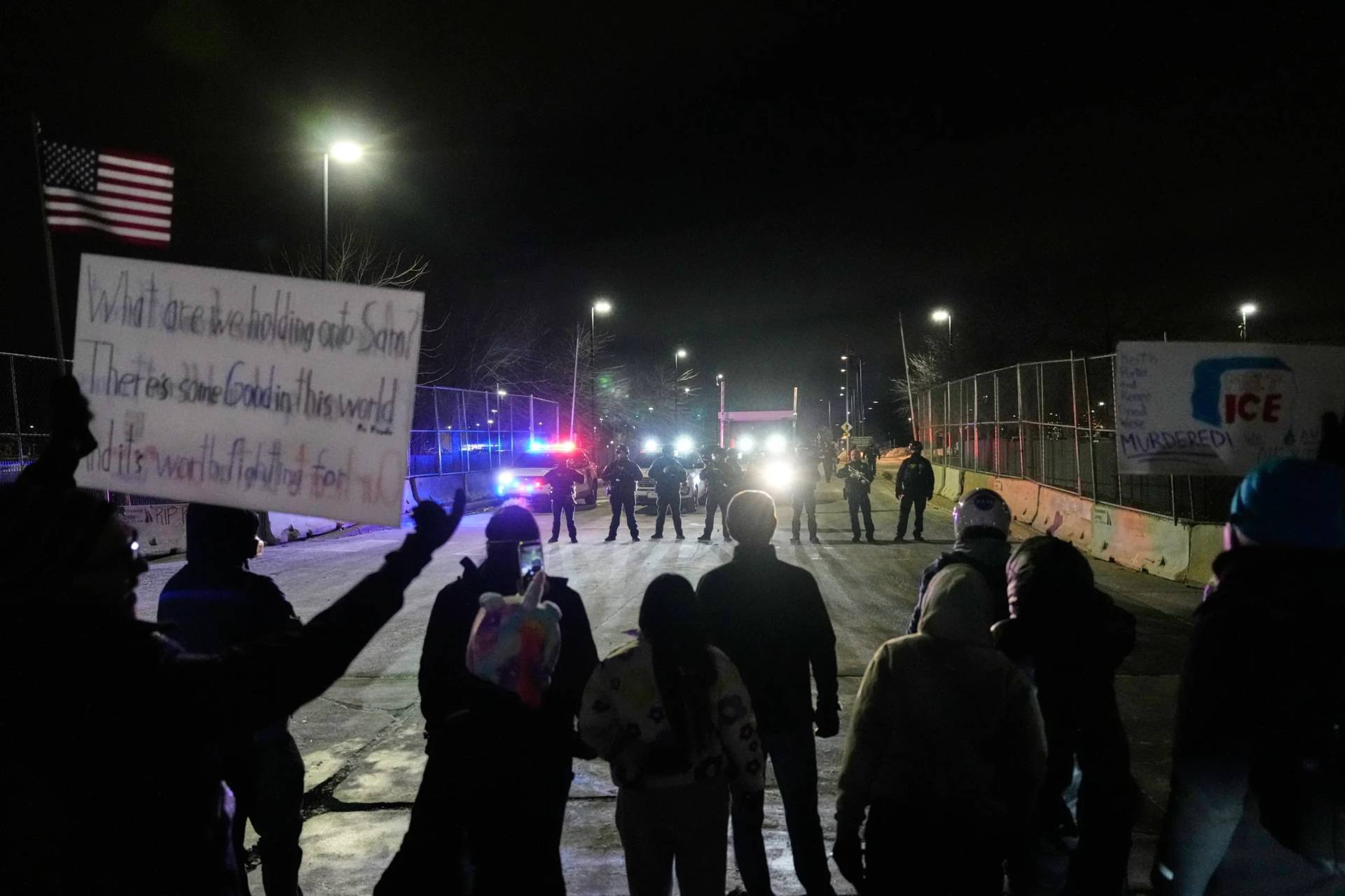 Federal immigration officers confront protesters outside Bishop Henry Whipple Federal Building in Minneapolis, on Thursday, Jan. 15, 2026. (Credit: Yuki Iwamura/AP.)