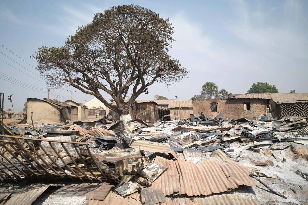 In a file photo, razed homes are seen a day after an attack that left dozens dead in the Muslim-majority village of Woro, Nigeria, on Nov. 5, 2025. (Credit: Pelumi Salako/AP.)