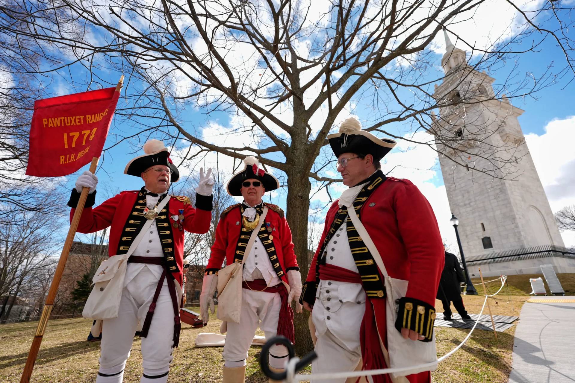 Pawtucket Rangers Militia reenactors assemble in an Evacuation Day ceremony marking the 1776 departure of British troops from the city during the American Revolutionary War, March 17, 2026, in Boston, Massachusetts. (Credit: Robert F. Bukaty/AP.)